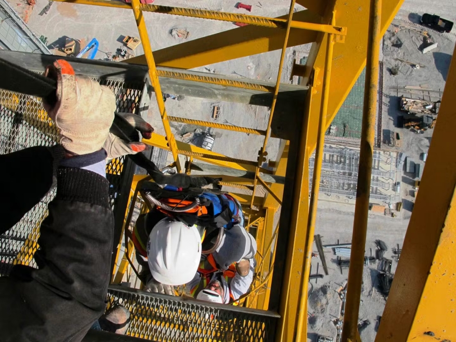Evacuation and self rescue skills are significant in construction because workers at height may need to exit a hard to reach location, such as a stadium rooftop or a tower crane cab, when normal access routes are unusable during an emergency. This type of training addresses the hazards and procedures involved in descending safely from elevated structures and reinforces the importance of being prepared for height related emergencies. Photo Credit: Tech Safety Lines