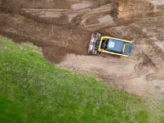 A skid steer is one of the most versatile machines in landscaping, capable of grading soil, moving materials, and clearing debris with precision. Its compact size and interchangeable attachments make it ideal for working in tight residential or commercial spaces.