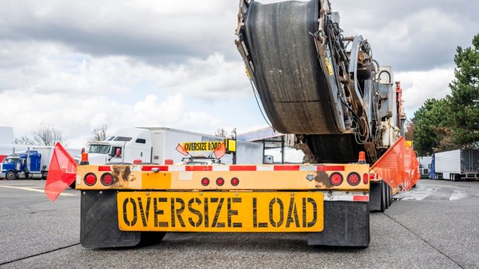 Industrial,Powerful,Big,Rig,Classic,Semi,Truck,Transporting,Oversized,Equipment Careful transport logistics are essential for relocating heavy or oversized machinery with minimal disruption. When rigging and hauling teams work in sync, production resumes faster and more efficiently.