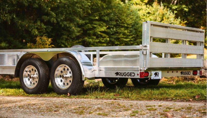 Aluminum trailers resist corrosion and offer a lighter towing weight compared to untreated steel models. This reduces fuel consumption and lowers long term maintenance costs for landscaping businesses. Photo Credit: Rugged Aluminum Trailers