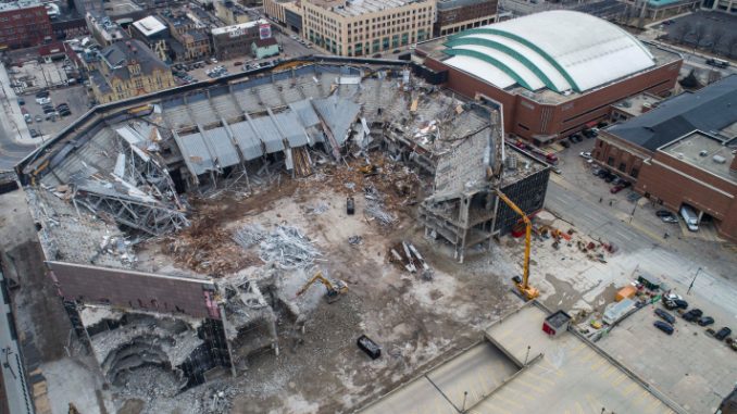 Safe large-scale demolitions begin with structural analysis and detailed sequencing to prevent collapse hazards. Crews ensure debris zones are clearly marked and use dust suppression systems to protect nearby environments and workers. Photo Credit: Veit