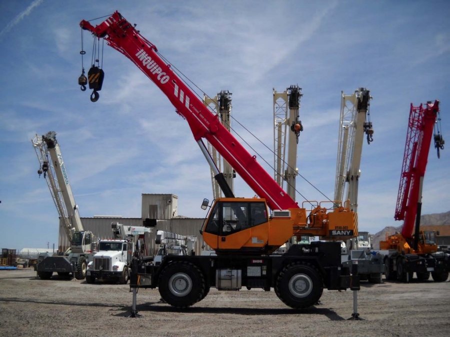 Rough terrain cranes use thick tires and strong axles to move confidently across mud, gravel, and uneven ground. They deliver reliable lifts in remote locations where other crane types cannot operate safely. Photo Credit: Inquipco