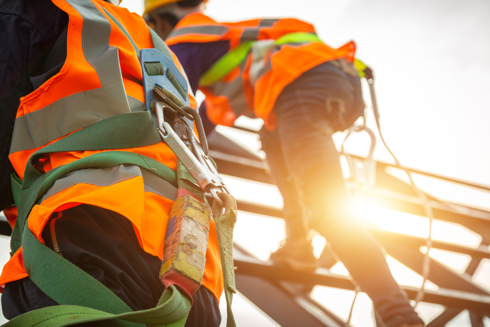 Personal fall arrest systems must limit the maximum arresting force on a worker to 1,800 pounds. Proper use of a harness, energy-absorbing connection, and secure anchorage is critical to meeting this requirement.