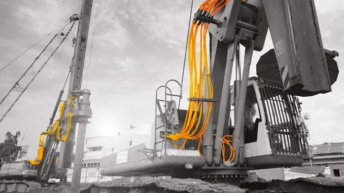 Hydraulic hose abrasion is one of the most commonly documented causes of premature hose failure in construction and industrial equipment. Continuous rubbing against metal surfaces can quickly wear through protective covers and weaken reinforcement layers. Photo Credit: Continental AG