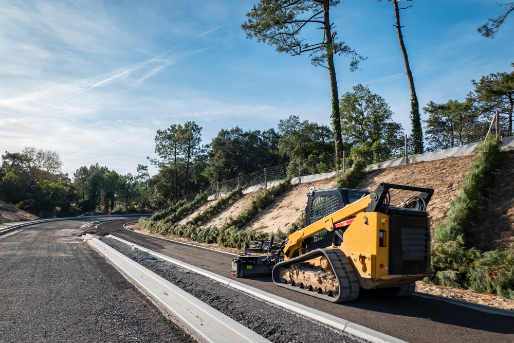 Compact track loaders provide lower ground pressure and improved traction by distributing machine weight across rubber tracks. This makes them well suited for soft soil, mud, and uneven terrain where wheeled machines may struggle.