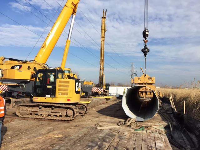 Crane mats are commonly used to reduce ground bearing pressure under crawler cranes and mobile cranes during lifting operations. By spreading loads over a wider area, they help prevent soil failure, uneven settlement, and crane instability on soft or variable ground conditions. Photo Credit: Buckeye Mats