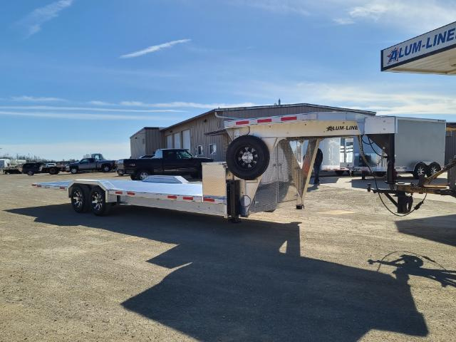 Aluminum gooseneck trailers can weigh thousands of pounds less than comparable steel models. That weight reduction allows contractors to carry more equipment while staying within legal limits. Photo Credit: Alum-Line Trailers