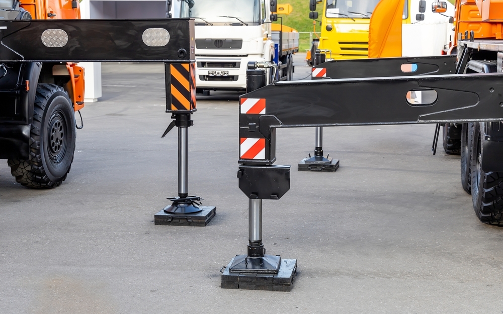 Wood outrigger pads experience performance variability due to grain structure, moisture absorption, and internal degradation. These factors can reduce load distribution effectiveness over repeated use.