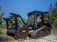 Compact track loaders distribute machine weight across rubber tracks, reducing ground pressure and improving stability on uneven terrain. This makes them better suited for steep grading compared to wheeled skid steers. Photo Credit: Pacific JCB