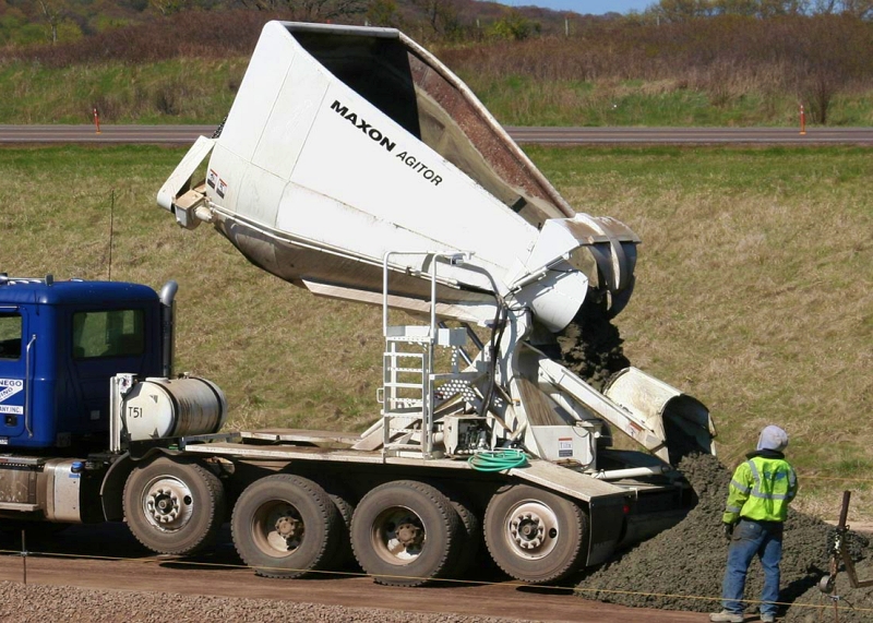 Controlled discharge and minimized transfer points help preserve mix uniformity. Consistent delivery practices improve pavement durability and reduce the risk of premature maintenance. Photo Credit: Maxon Industries