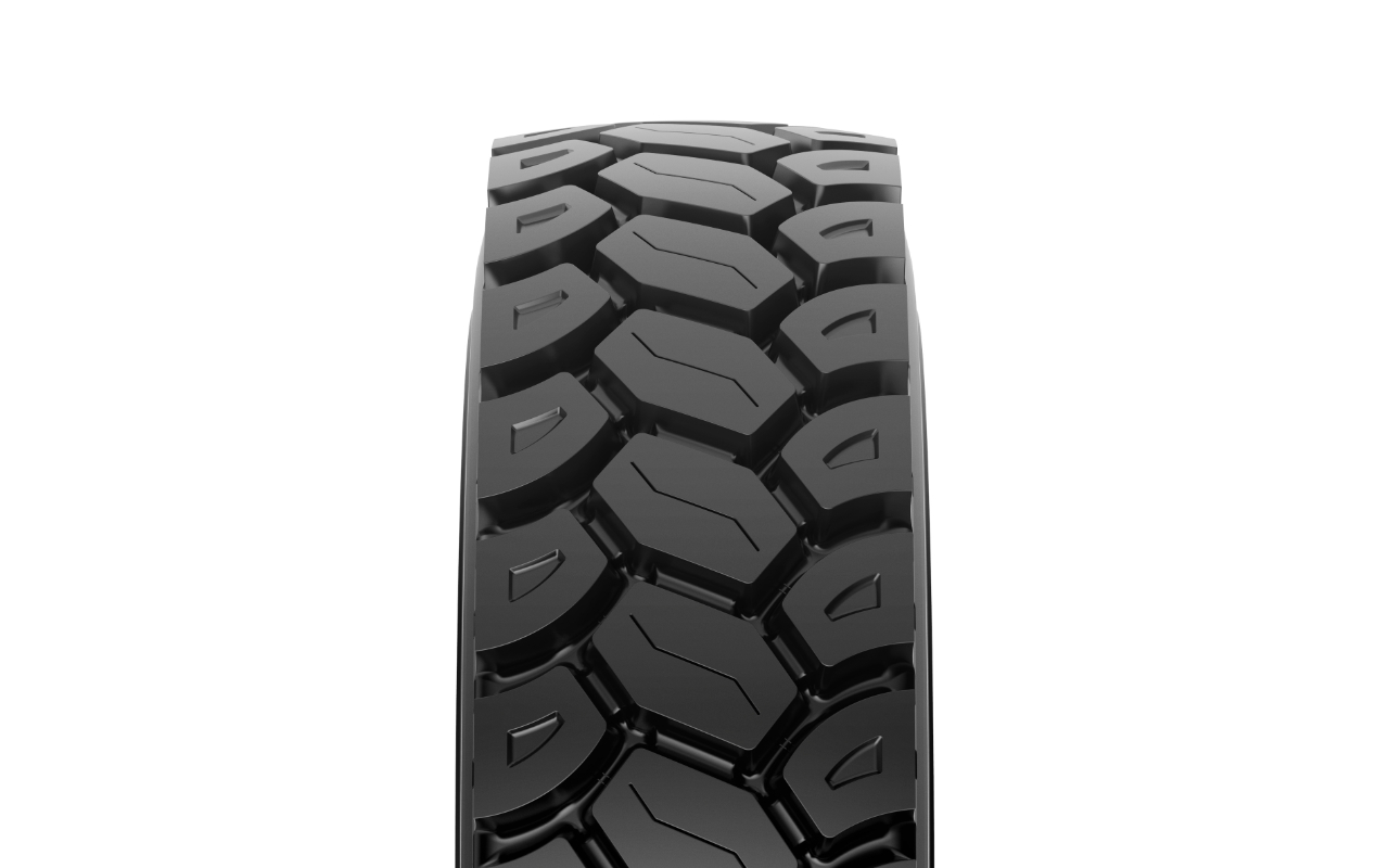 Close-up of MAXAM MS401 deep-groove E4 OTR tread pattern designed for traction and heat management