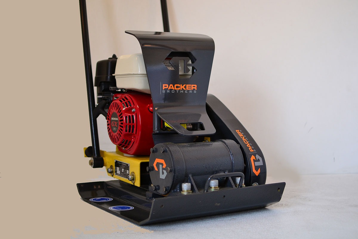 Packer Brothers plate compactor with Honda engine and yellow frame on studio background
