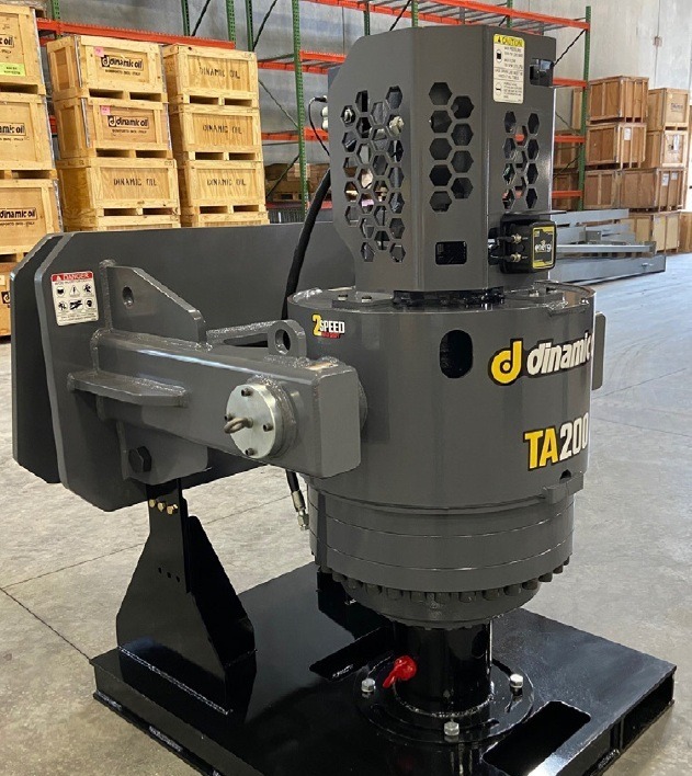 Gray Dinamic Oil TA200 two-speed auger drive unit on shipping base in warehouse