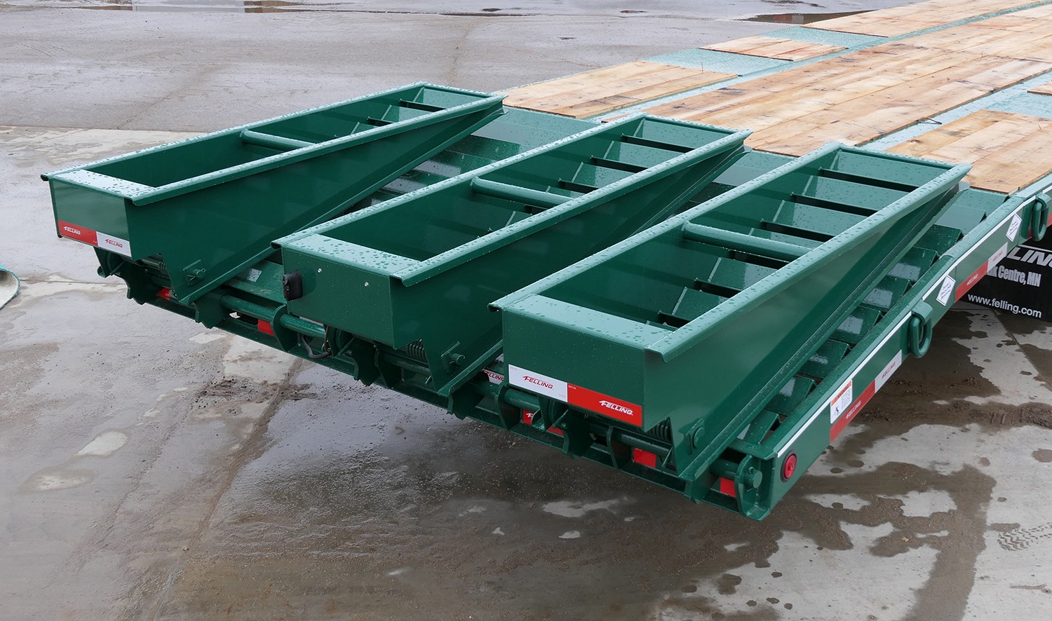 Rear of Felling deck-over trailer with three ramps lowered and side D-rings visible