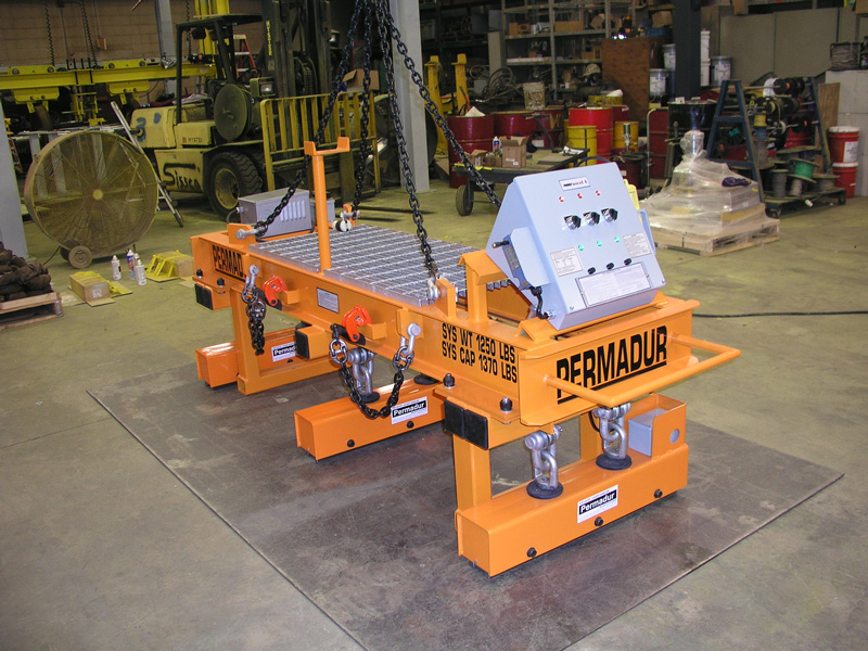 Orange multi-magnet lifting beam with selective control panels and grid of magnets against black background