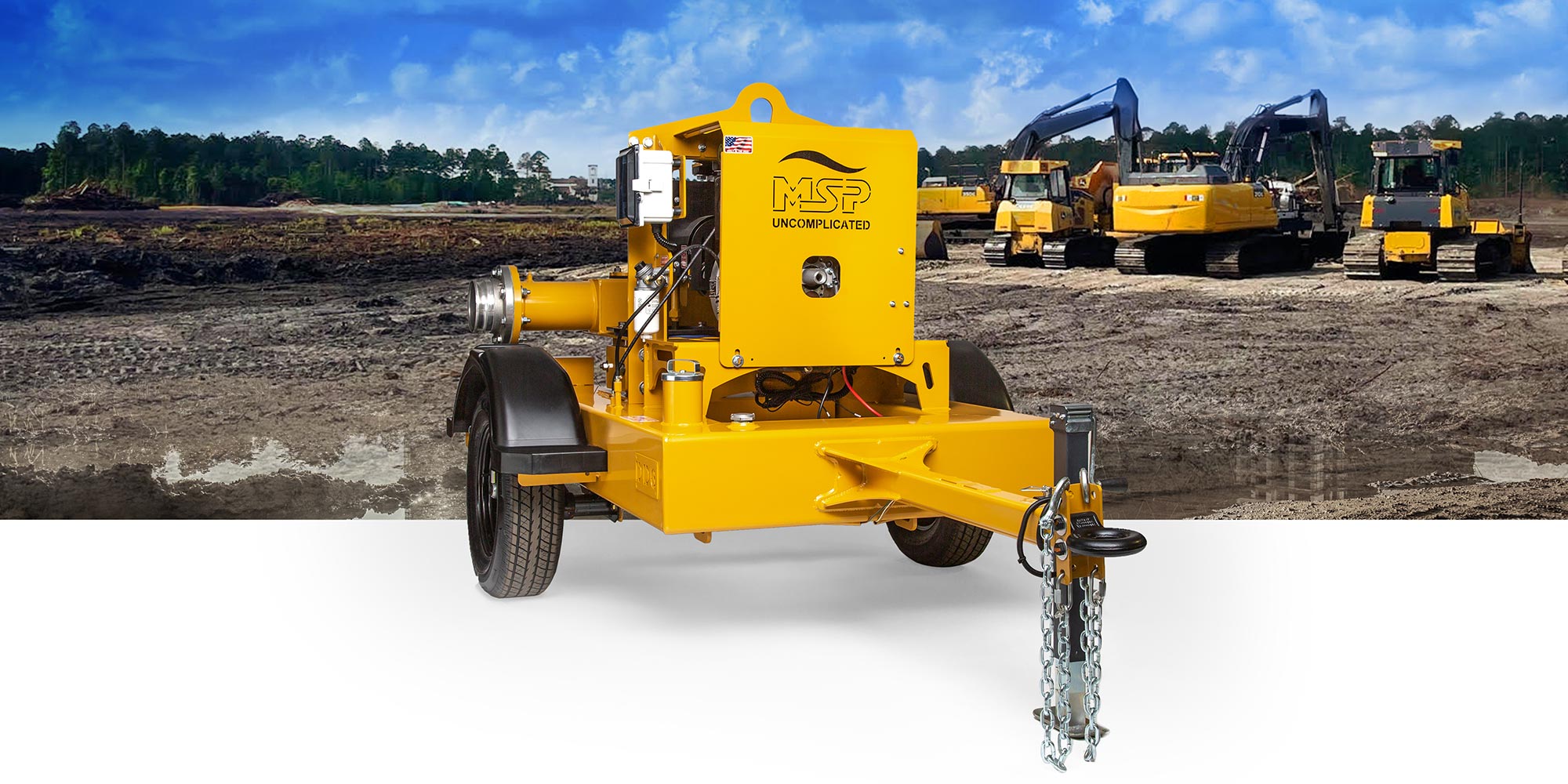 Yellow MSP trailer-mounted dewatering pump in foreground with excavators on a muddy jobsite behind