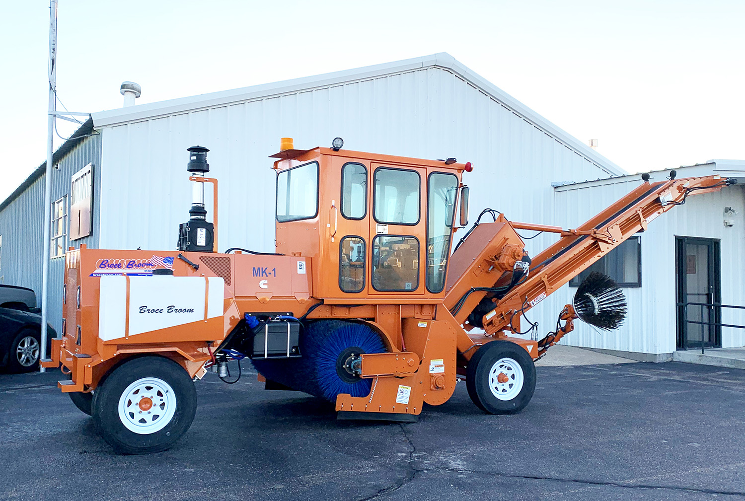 Transfer sweeper with conveyor for sweeping and loading millings