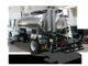 Etnyre asphalt distributor truck showing rear spray bar, nozzles, and stainless tank