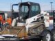 Bobcat compact track loader secured on a tandem-axle equipment trailer