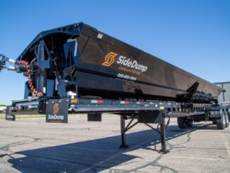 Black side dump trailer for construction material hauling