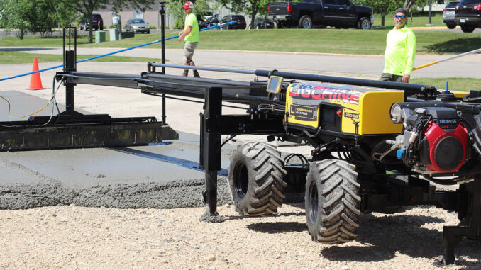 Laser-guided boom screed placing commercial flatwork for FF/FL control