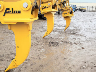 Yellow Felco excavator ripper shanks in equipment yard