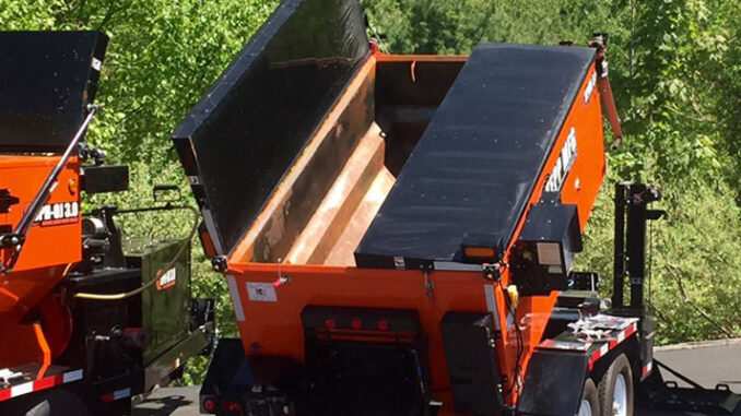 Lineup of asphalt hot box patch trailers for keeping hot mix workable