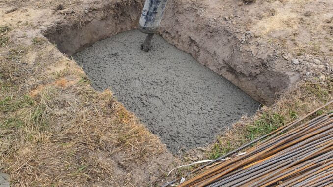 Concrete pour against formed walls where tie load path matters