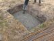 Concrete pour against formed walls where tie load path matters