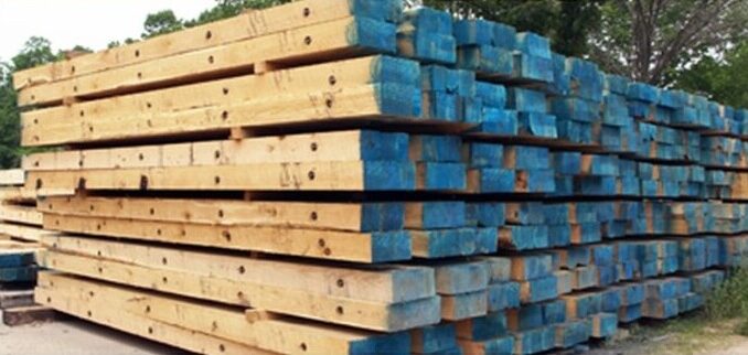 Stack of blue-end timber crane mats ready for haul